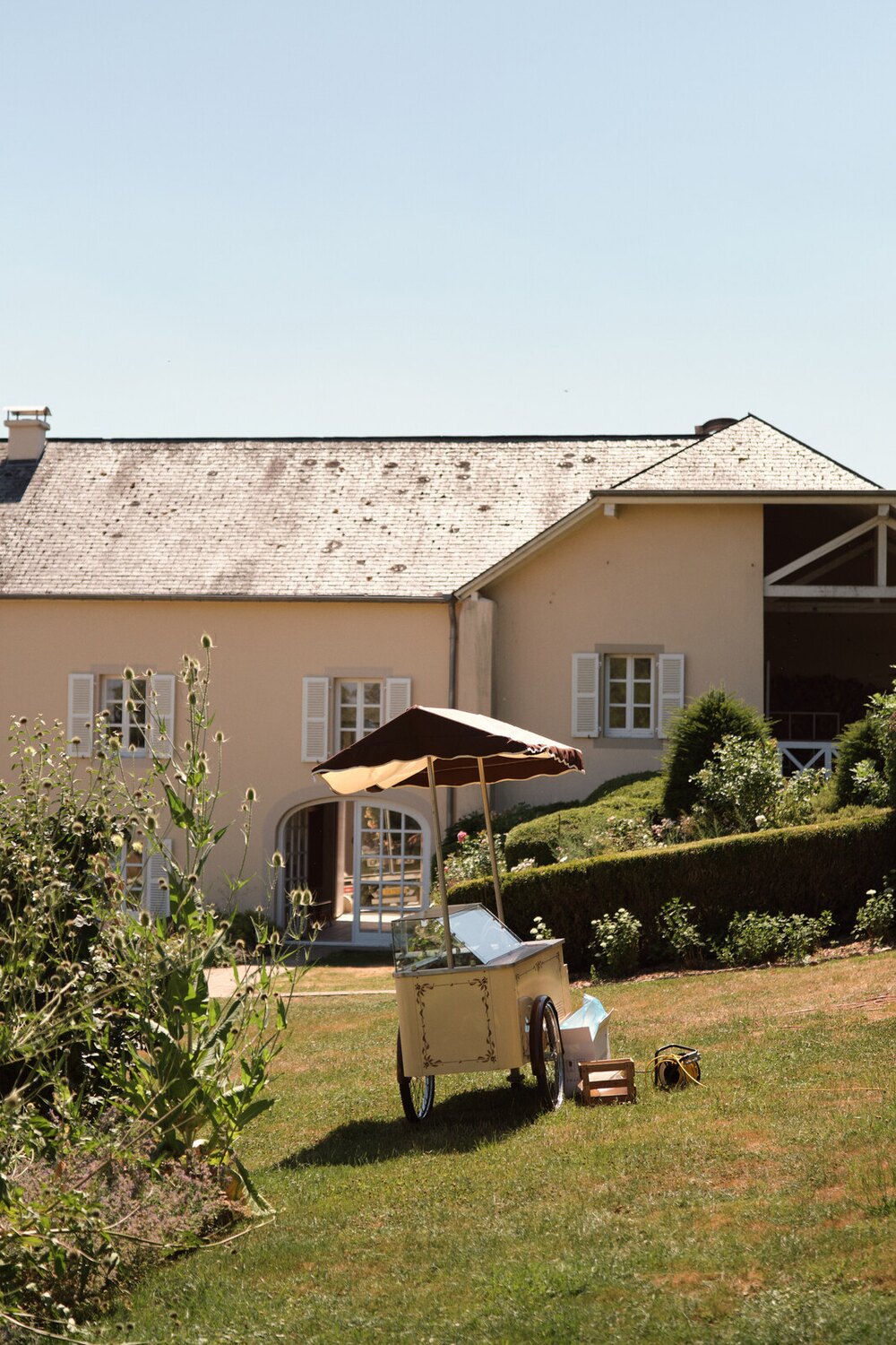 The garden side of Hazelnut House with the drinks cart and the barn wing